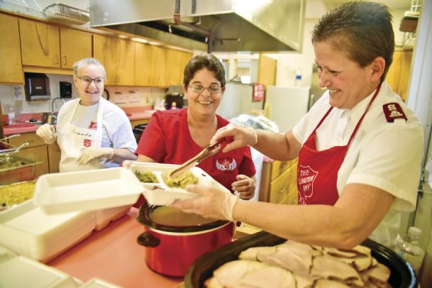 Serving Thanksgiving lunch: Salvation Army, volunteers feed area needy